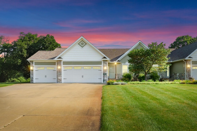 3229 Nighthawk Ln, Battle Creek, MI 49015 - single story home with driveway, a garage, a yard, and stone siding
