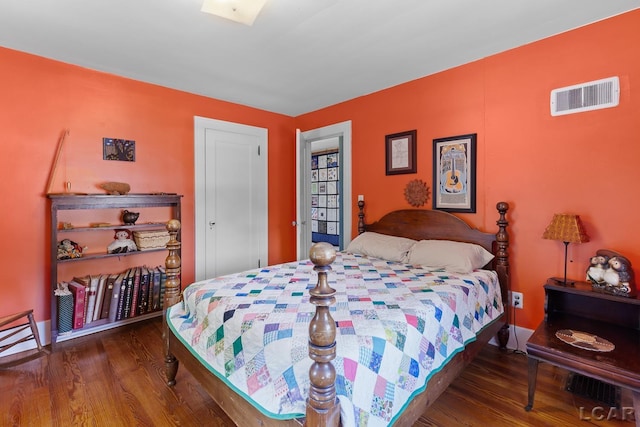 1044 Michigan Ave, Adrian, MI 49221 - bedroom featuring wood finished floors and baseboards