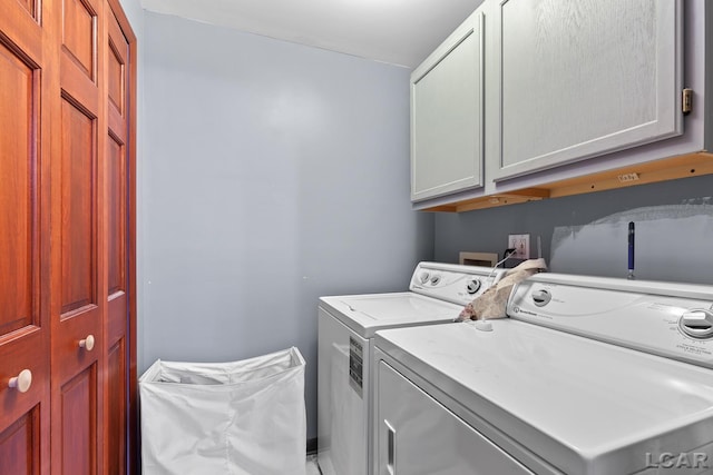 1044 Michigan Ave, Adrian, MI 49221 - laundry area with cabinet space and washing machine and clothes dryer