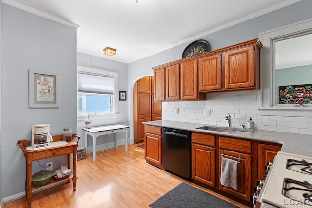 1044 Michigan Ave, Adrian, MI 49221 - kitchen featuring black dishwasher, decorative backsplash, light wood finished floors, white gas range, and brown cabinetry