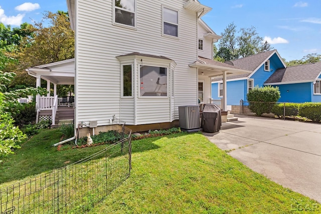 1044 Michigan Ave, Adrian, MI 49221 - view of front of house featuring concrete driveway and a patio area