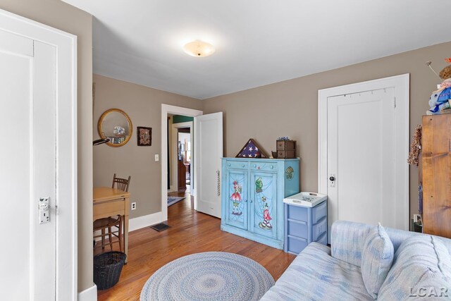 1044 Michigan Ave, Adrian, MI 49221 - sitting room with light wood-type flooring and baseboards