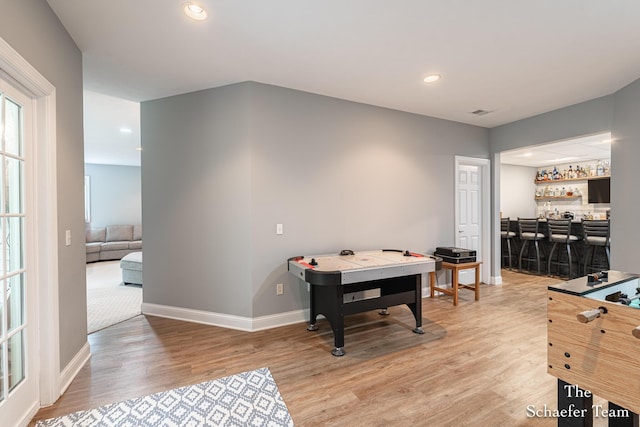 5264 Deverman Ct NE, Lowell, MI 49331 - recreation room featuring wet bar, light wood-style flooring, and recessed lighting