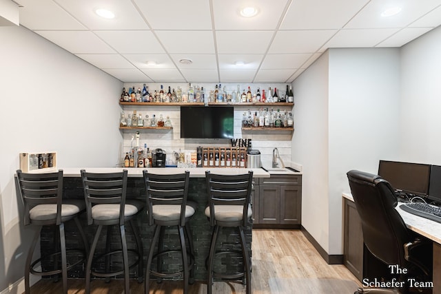 5264 Deverman Ct NE, Lowell, MI 49331 - indoor wet bar with light wood finished floors, a drop ceiling, recessed lighting, and tasteful backsplash