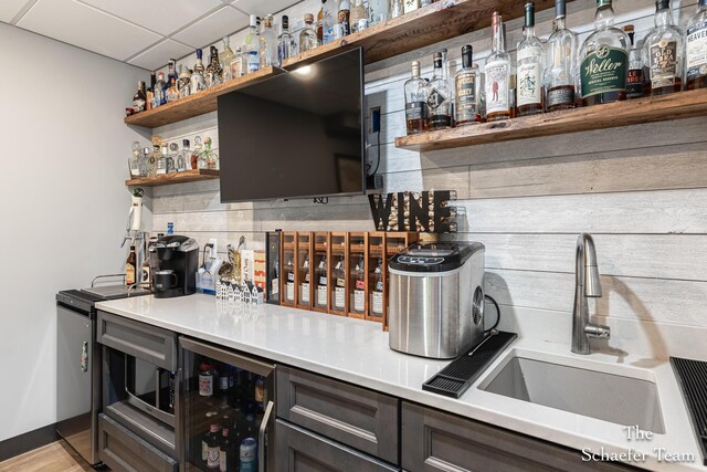 5264 Deverman Ct NE, Lowell, MI 49331 - indoor dry bar with wine cooler and a drop ceiling