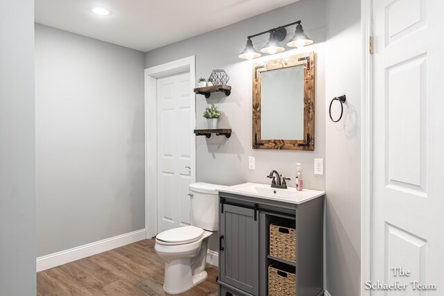 5264 Deverman Ct NE, Lowell, MI 49331 - bathroom featuring vanity, wood finished floors, and recessed lighting