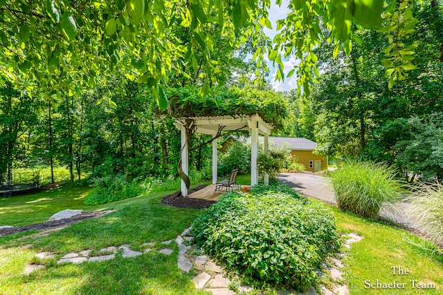5264 Deverman Ct NE, Lowell, MI 49331 - view of grassy yard featuring a pergola and a patio