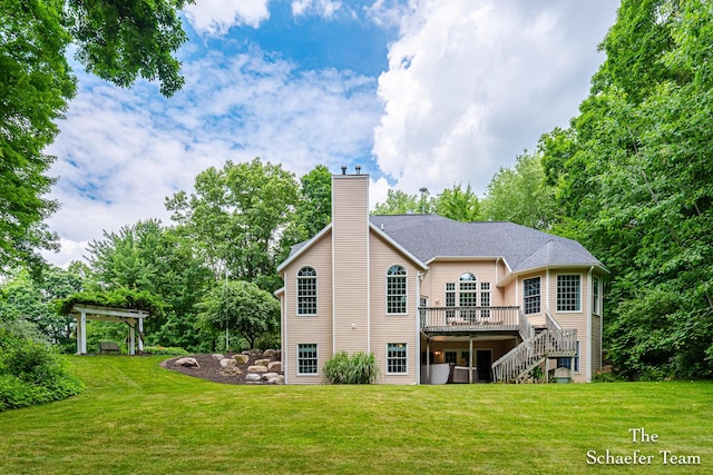 5264 Deverman Ct NE, Lowell, MI 49331 - rear view of property with a deck, a chimney, stairs, and a lawn