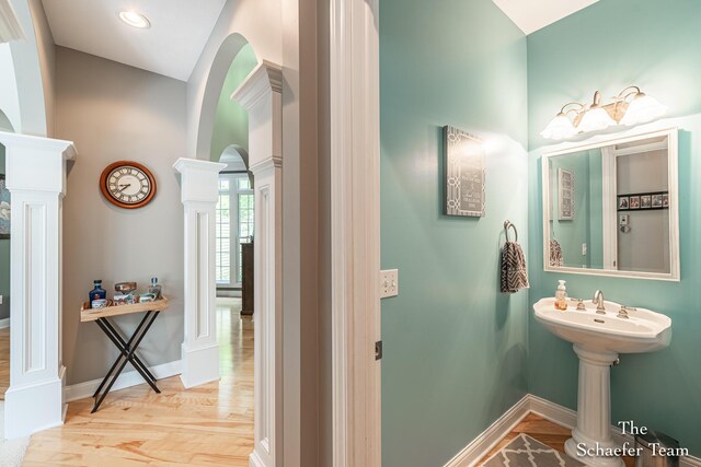 5264 Deverman Ct NE, Lowell, MI 49331 - bathroom featuring decorative columns and wood finished floors