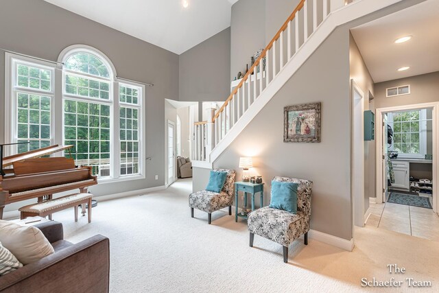 5264 Deverman Ct NE, Lowell, MI 49331 - sitting room featuring carpet, stairs, and a high ceiling