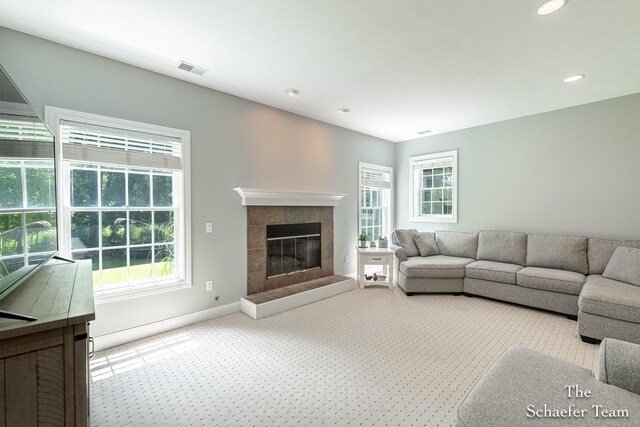 5264 Deverman Ct NE, Lowell, MI 49331 - carpeted living room with plenty of natural light, recessed lighting, and a fireplace