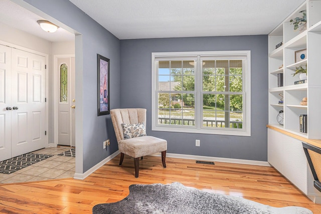 4166 Grandwood Cir, Saint Joseph, MI 49085 - sitting room with wood finished floors and baseboards