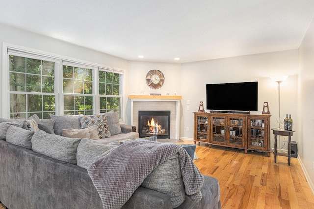 4166 Grandwood Cir, Saint Joseph, MI 49085 - living room with light wood-style floors, recessed lighting, and a brick fireplace