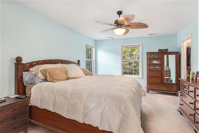 4166 Grandwood Cir, Saint Joseph, MI 49085 - bedroom featuring light colored carpet and a ceiling fan