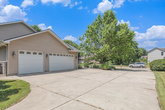 4166 Grandwood Cir, Saint Joseph, MI 49085 - view of side of property featuring driveway and a garage