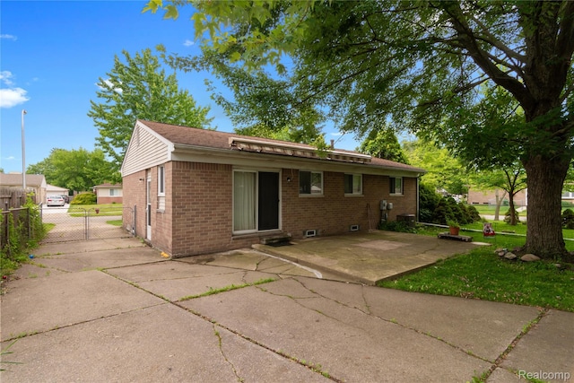 9892 Wheeler St, Van Buren, MI 48111 - back of house featuring brick siding and a patio