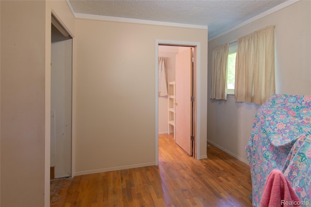 9892 Wheeler St, Van Buren, MI 48111 - living area featuring wood finished floors, ornamental molding, and a textured ceiling