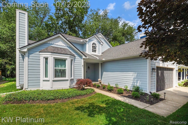 3708 Eaton Gate Ln, Auburn Hills, MI 48326 - view of front of house featuring a garage, a chimney, a front yard, and driveway