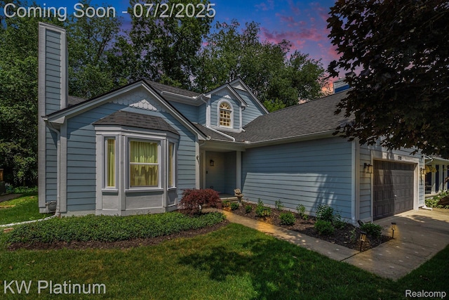 3708 Eaton Gate Ln, Auburn Hills, MI 48326 - view of front of property with an attached garage, a chimney, a yard, and driveway