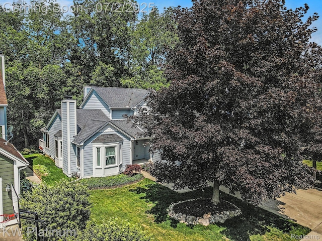 3708 Eaton Gate Ln, Auburn Hills, MI 48326 - view of front of property featuring a chimney and a shingled roof