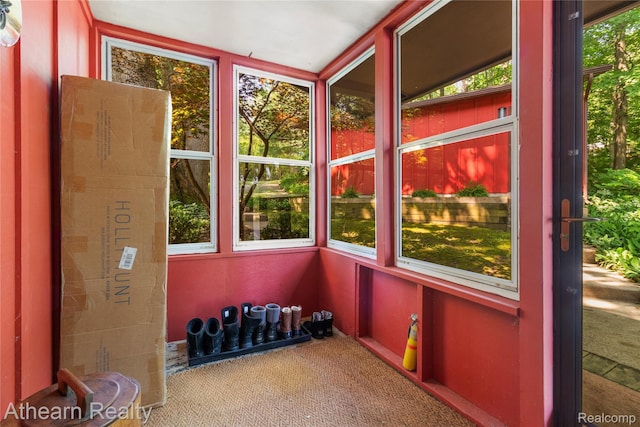 6600 W Shore Dr, Weidman, MI 48893 - unfurnished sunroom featuring carpet