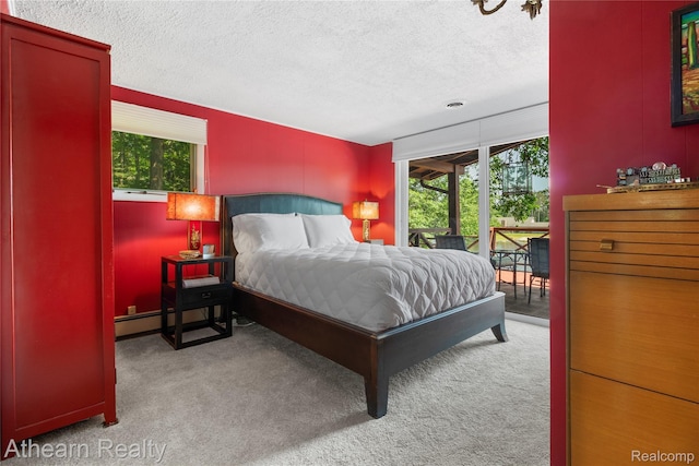 6600 W Shore Dr, Weidman, MI 48893 - bedroom featuring access to outside, carpet, and a textured ceiling