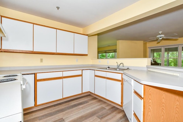 2208 Parkview Ave, Kalamazoo, MI 49008 - kitchen featuring white appliances, light countertops, light wood-type flooring, and white cabinetry
