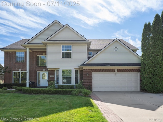 39104 Devonshire Ct, Harrison Township, MI 48045 - view of front of house featuring brick siding, driveway, a front lawn, and a garage