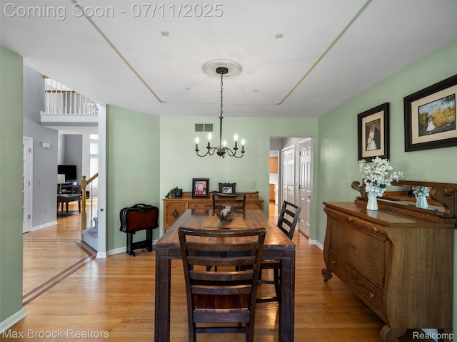 39104 Devonshire Ct, Harrison Township, MI 48045 - dining room with light wood-style floors and a chandelier