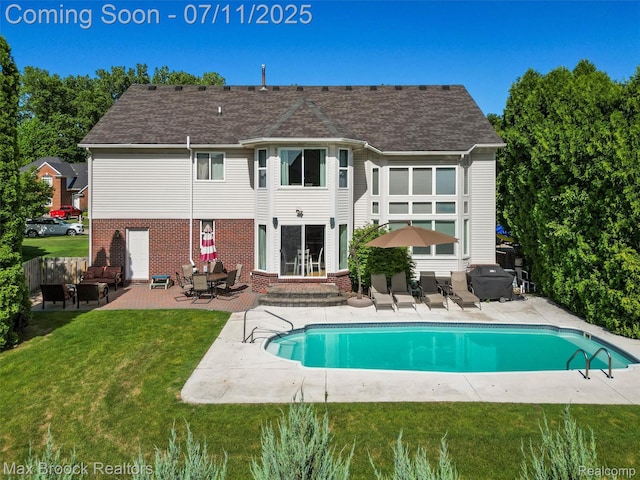 39104 Devonshire Ct, Harrison Township, MI 48045 - back of property with a patio area, entry steps, brick siding, and a yard