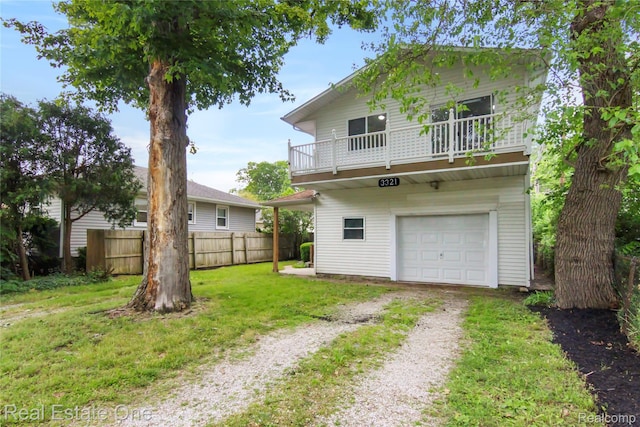 3321 Stone St, Port Huron, MI 48060 - rear view of property with driveway, a balcony, and a garage