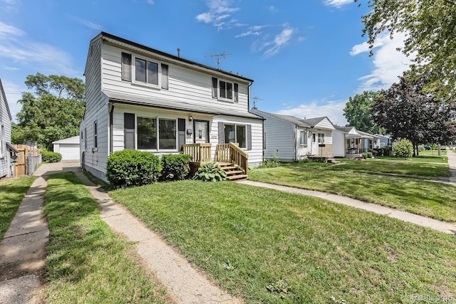 21048 Audrey Ave, Warren, MI 48091 - traditional-style house with an outbuilding, a front yard, and a detached garage