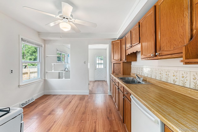 21048 Audrey Ave, Warren, MI 48091 - kitchen featuring white appliances, brown cabinets, light wood finished floors, light countertops, and backsplash
