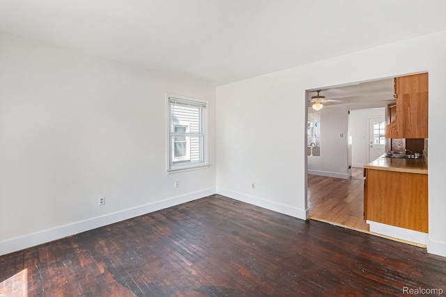 21048 Audrey Ave, Warren, MI 48091 - unfurnished living room with dark wood finished floors and a ceiling fan
