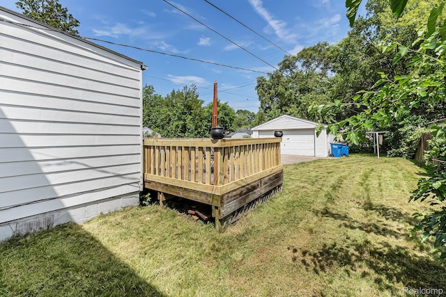 21048 Audrey Ave, Warren, MI 48091 - view of yard featuring a wooden deck, a detached garage, and an outbuilding