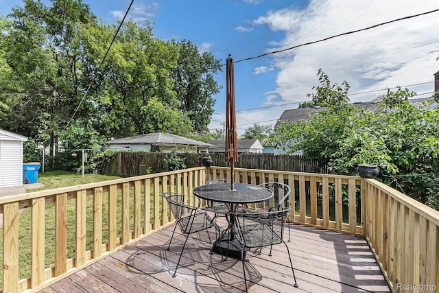 21048 Audrey Ave, Warren, MI 48091 - deck featuring outdoor dining area and a fenced backyard