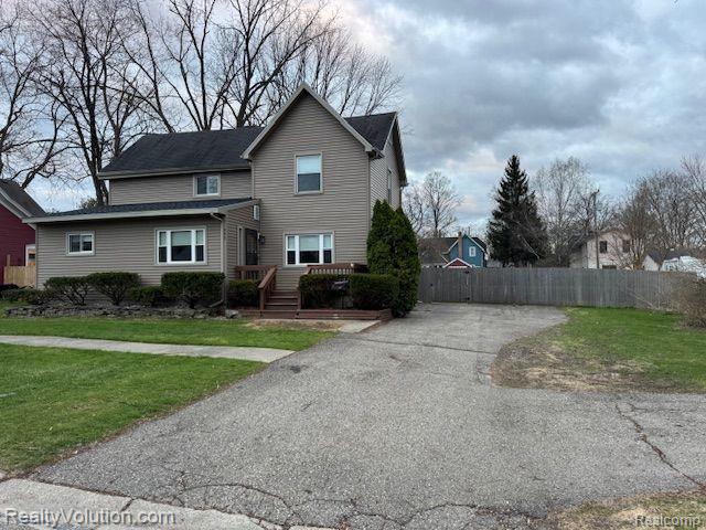 245 6th St, Imlay City, MI 48444 - traditional home featuring asphalt driveway