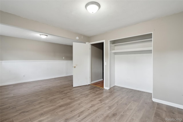 637 Lexington Ave, East Lansing, MI 48823 - unfurnished bedroom featuring wood finished floors and a closet