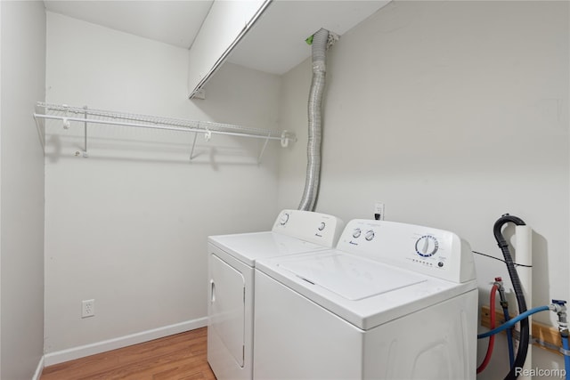 637 Lexington Ave, East Lansing, MI 48823 - laundry room featuring washer and clothes dryer and light wood-style flooring