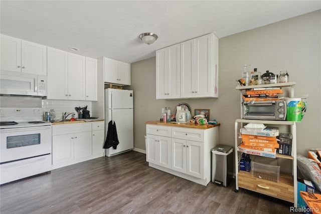 637 Lexington Ave, East Lansing, MI 48823 - kitchen with white appliances, dark wood finished floors, white cabinetry, and tasteful backsplash