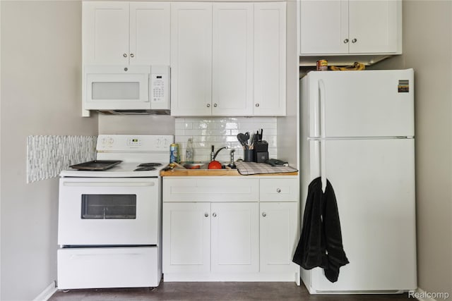 637 Lexington Ave, East Lansing, MI 48823 - kitchen with white appliances, white cabinetry, light countertops, and decorative backsplash
