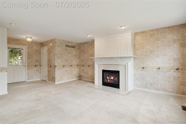 10074 Pond View Trl, Holly, MI 48442 - unfurnished living room featuring a tiled fireplace and light colored carpet
