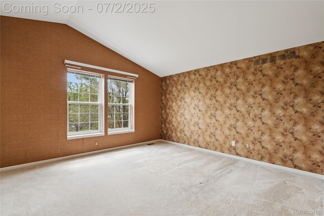10074 Pond View Trl, Holly, MI 48442 - carpeted empty room with lofted ceiling and wallpapered walls