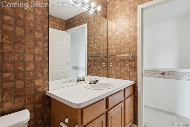 10074 Pond View Trl, Holly, MI 48442 - bathroom featuring vanity and tile walls