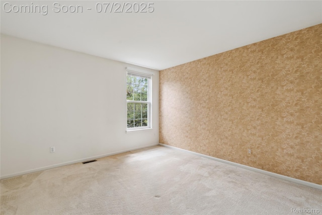 10074 Pond View Trl, Holly, MI 48442 - spare room with carpet and wallpapered walls
