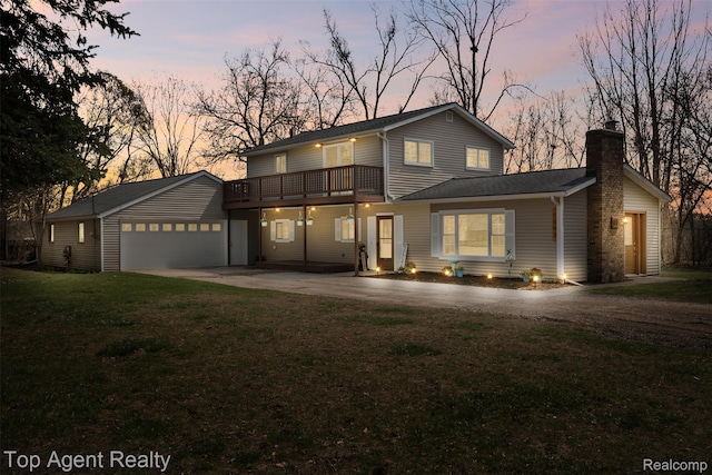 1593 Parke St, Rochester Hills, MI 48307 - traditional-style house with driveway, a chimney, a front yard, and a garage