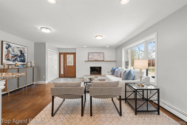 1593 Parke St, Rochester Hills, MI 48307 - living area with wood finished floors, a brick fireplace, and recessed lighting