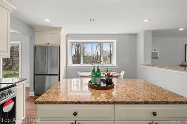 1593 Parke St, Rochester Hills, MI 48307 - kitchen with appliances with stainless steel finishes, light stone counters, light wood-type flooring, recessed lighting, and a center island