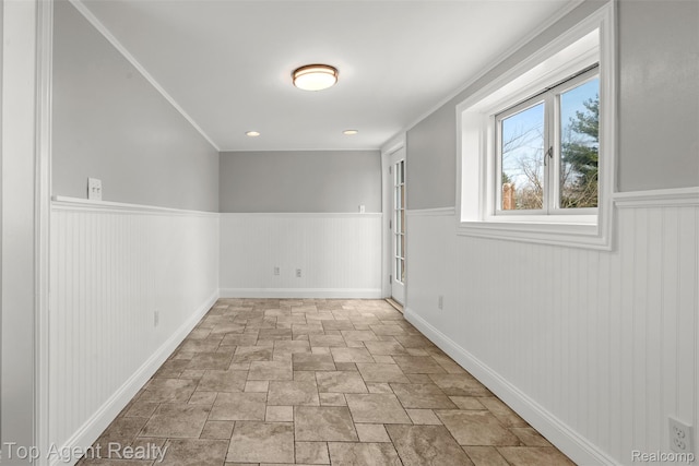 1593 Parke St, Rochester Hills, MI 48307 - unfurnished room with wainscoting, stone finish flooring, and crown molding