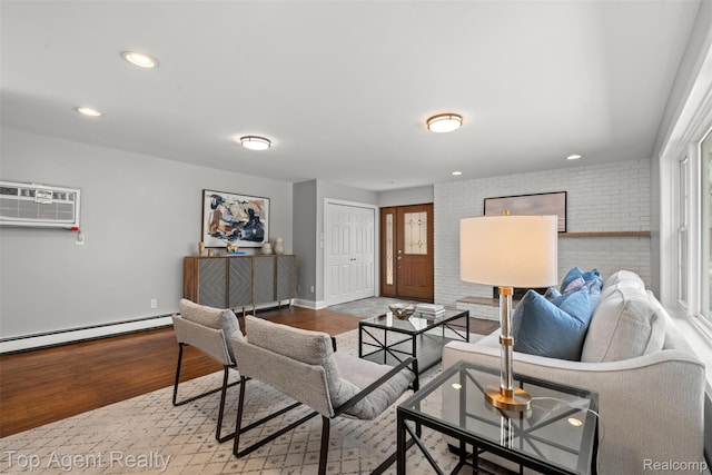 1593 Parke St, Rochester Hills, MI 48307 - living area with a baseboard radiator, an AC wall unit, wood finished floors, recessed lighting, and brick wall